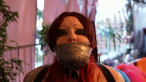 bondagecrossdresser.com - Helpless bound on the Bondage Chair with a tight Tapegag thumbnail