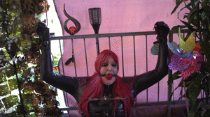 Tied to a Grid in Latex Catsuit